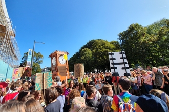 Hundreds of young people at a climate strike on a sunny day